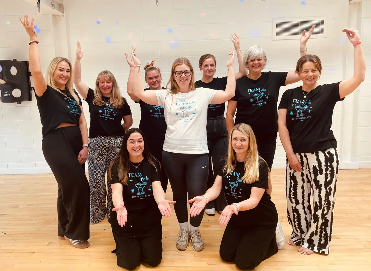 A hen party dance class group mid-celebration